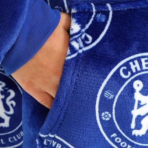 A hand going into the large front pocket of a blue Luxury Fleece Chelsea FC print hoodie.