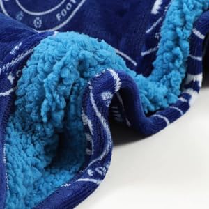 This image shows the light blue fleece lining and outer dark blue fabric of the Chelsea FC hoodie