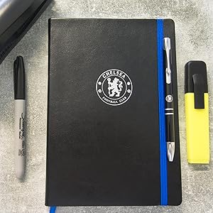 Notebook and pen with other stationary items