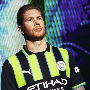 Soccer jersey featuring black and yellow stripes with 'ETIHAD' branding, displayed against a blue and purple digital background.