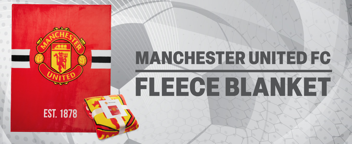 Manchester United FC fleece blanket packaging. Red and gray design with team crest and 'EST. 1878' text. Product name clearly visible.
