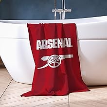 Text reads 'ARSENAL'. Multiple images of red and white decorative pillows or cushions with sports-themed designs, shown in different arrangements on furniture.