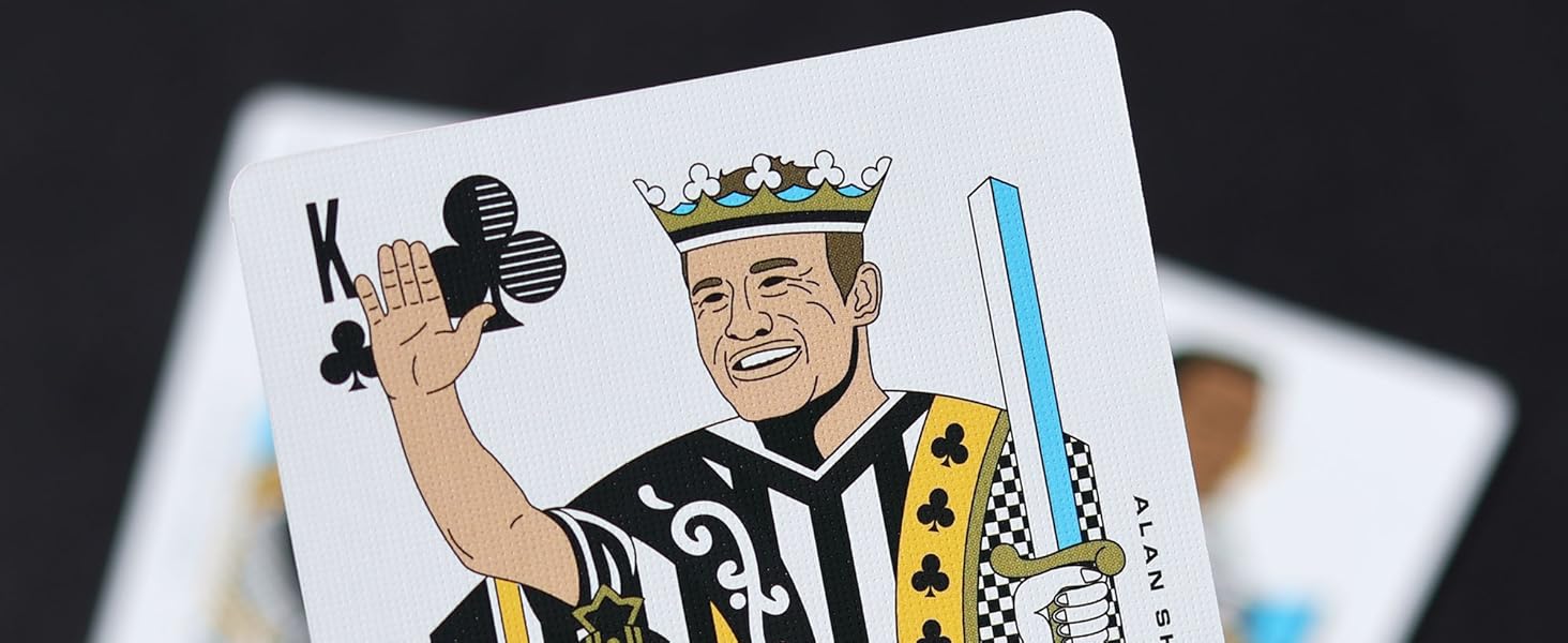 Playing card featuring stylized King of Clubs design with character holding club and scepter, wearing crown and checkered outfit.