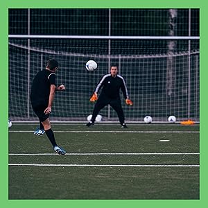 Soccer Biography Books - player kicking soccer ball at goalie